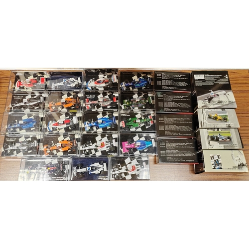 343 - Minichamps. Collection of F1 cars and helmets generally mint in mostly very good to excellent plasti... 