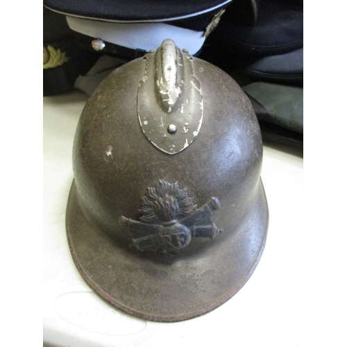 169 - Headdress collection including WW1 Adrian helmet, green & black bicorn by Ede & Ravenscoft, majority... 