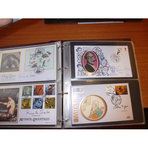 312 - FDCs in 4 albums from 1973 to 2010, incl a range of military items with autographs  incl Bill Reid, ... 