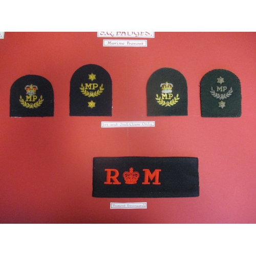 142 - Royal Marines collection of Specialist Qualifications and Trade Qualification sleeve badges mounted ... 