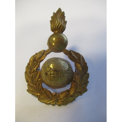 151 - Royal Marine Artillery SNCO's forage cap badge, 1921 Pattern in gilt, globe surrounded by laurel wre... 