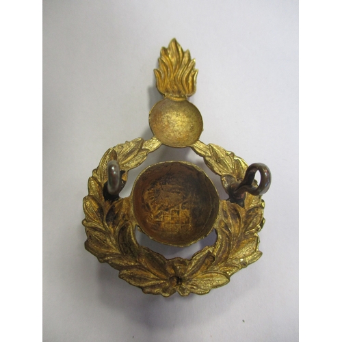 151 - Royal Marine Artillery SNCO's forage cap badge, 1921 Pattern in gilt, globe surrounded by laurel wre... 