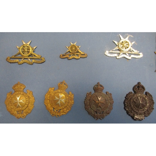 167 - Good Maltese badge and insignia collection (40 items) mounted on card including Royal Malta Artiller... 