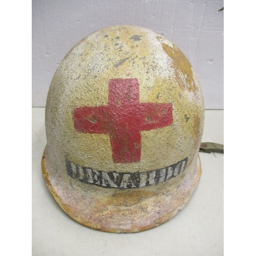 180 - WW2 U.S. Medic casualty's M-1 helmet and liner, shell with white textured paint with large Red Cross... 