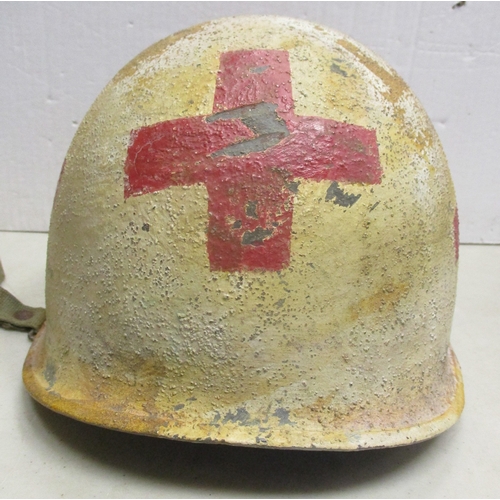 180 - WW2 U.S. Medic casualty's M-1 helmet and liner, shell with white textured paint with large Red Cross... 