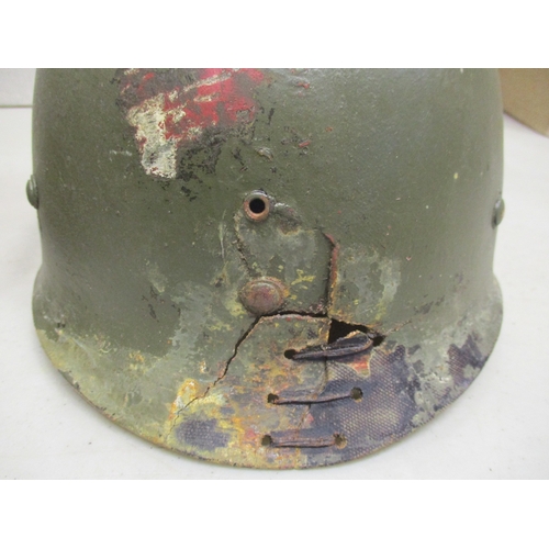 180 - WW2 U.S. Medic casualty's M-1 helmet and liner, shell with white textured paint with large Red Cross... 