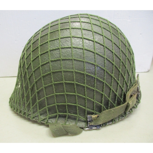 185 - U.S. Paratrooper's M-1 helmet and liner, green textured painted shell, webbing A strap with webbing ... 