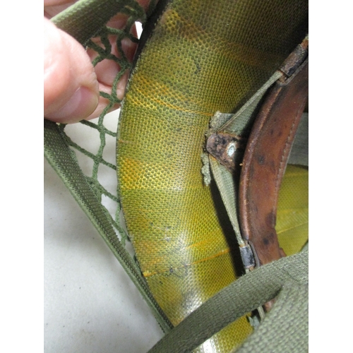 185 - U.S. Paratrooper's M-1 helmet and liner, green textured painted shell, webbing A strap with webbing ... 