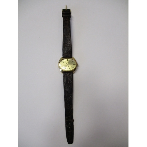 421 - 18ct gold banded wristwatch with plan dial, baton hands, stick indices, plain bezel, reverse  N2 2 6... 