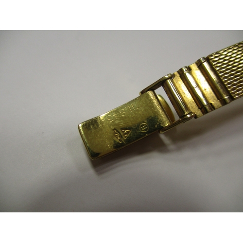 424 - Omega. Bracelet watch, 18ct gold, 'SWISS MADE' with plan dial, baton hands, stick indices, plain bez... 