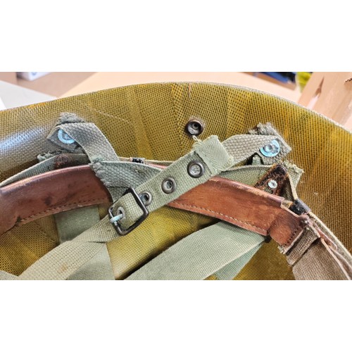 185 - U.S. Paratrooper's M-1 helmet and liner, green textured painted shell, webbing A strap with webbing ... 