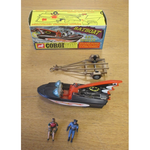 231 - Corgi. Batboat on Trailer No. 107, black plastic boat, tinplate fin cover, Batman and Robin figures,... 