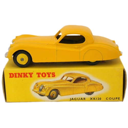 264 - Dinky. Jaguar XK 120 Coupe No. 157, yellow body with silver trim, mid-yellow ridged hubs with smooth... 