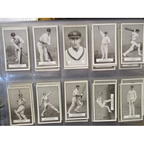 3 - Collection in multiple albums including complete sets from Gallaher Famous Cricketers, Woodland Tree... 