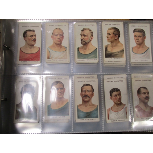 47 - Ogdens. Collection in two album with album of Champions of 1936, Guinea Golds, plus odds and part se... 