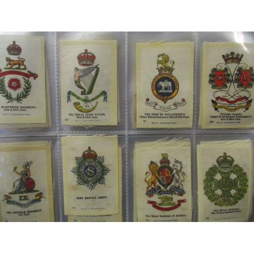 48 - Phillips. Collection in 2 albums of silks including Birds, British Naval Crests, Flags, Regimental C... 