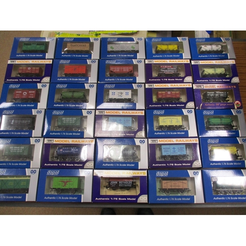 489 - Dapol. Collection of OO gauge wagons generally excellent in excellent boxes. Qty 100 approx. (2B)