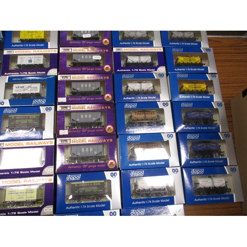 491 - Dapol. Collection of boxed OO gauge wagons, heavy duplication, generally mint in mint boxes. Qty 95 ... 