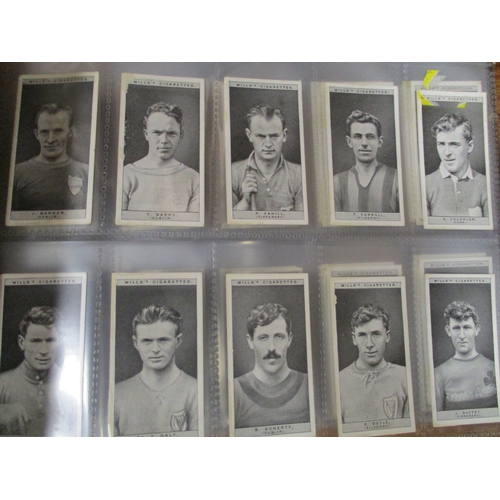 5 - Collection in 13 albums and 4 stock books including ranges from Mitchell, Ogdens including Guinea Go... 