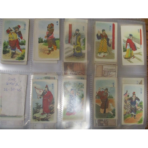 5 - Collection in 13 albums and 4 stock books including ranges from Mitchell, Ogdens including Guinea Go... 