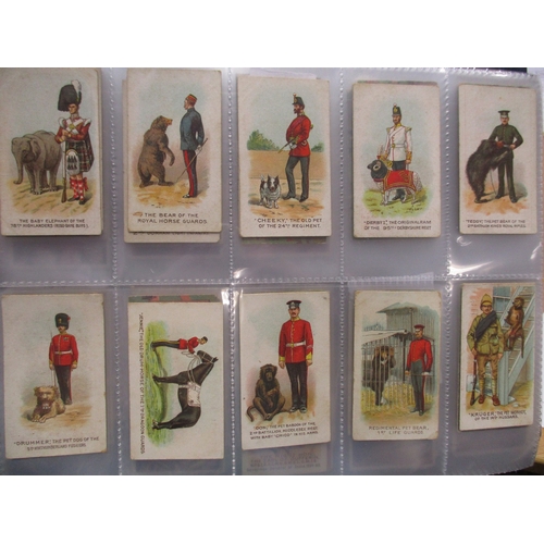 66 - Wills. Scissors collection in album with complete sets including Britains Defenders, Cinema Stars, D... 