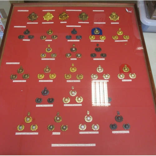 128 - Royal Marine 1905-72 plate and badge collection mounted in large glass frame 82cm x 95cm, includes h... 