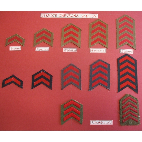 151 - Royal Marine collection mounted on 5 boards and 1 glass frame including embroided cap badges with Lo... 