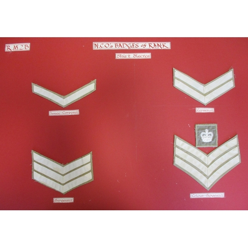 159 - Royal Marines collection of cloth sports colours and rank badges and slides mounted on 10 boards wit... 