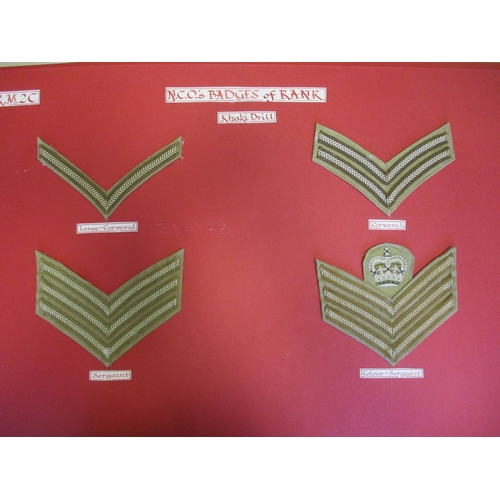 159 - Royal Marines collection of cloth sports colours and rank badges and slides mounted on 10 boards wit... 