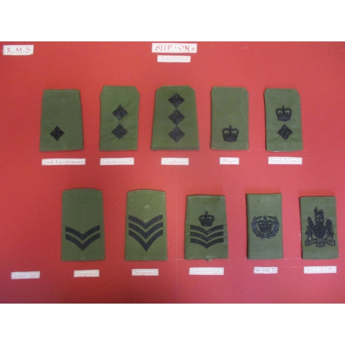 159 - Royal Marines collection of cloth sports colours and rank badges and slides mounted on 10 boards wit... 