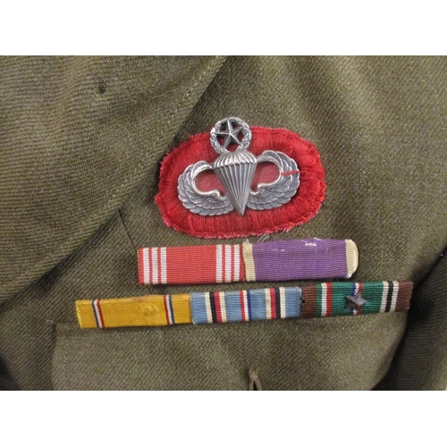 181 - Mixed range including US Navy wool jacket, US Army tunic with paratrooper's insignia and badges for ... 