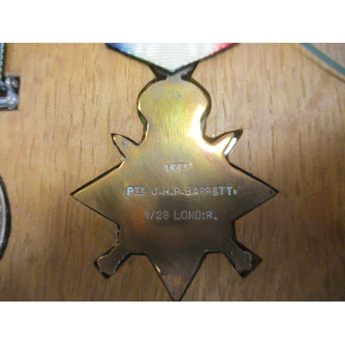 64 - 1914 Star with date bar to 1777 Pte J.H.P. Barrett 1/28 Lond R., BWM and Victory Medal to Lieut J.H.... 