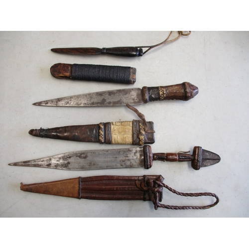 99 - Native edged weapons range with:
1. Indian Katar punch dagger, tip is broken.
2. African/Middle East... 