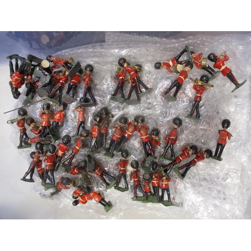175 - Unboxed collection of metal and plastic figures, range of makers with Britains etc, mostly Guards & ... 