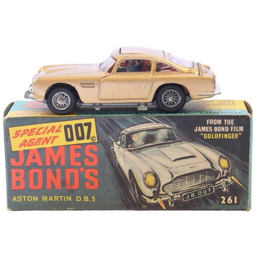 401 - Corgi. James Bond Aston Martin No.261 with inner stand, bandit figure, secret instructions and Corgi... 