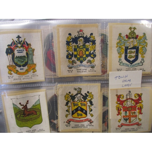 48 - Phillips. Collection in 2 albums of silks including Birds, British Naval Crests, Flags, Regimental C... 