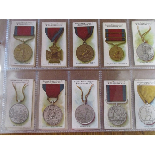 50 - Taddy. Complete set in plastic sleeves British Medals (black) generally good. Cat. £750. (See photo)... 
