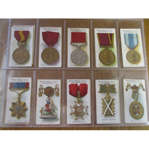 50 - Taddy. Complete set in plastic sleeves British Medals (black) generally good. Cat. £750. (See photo)... 