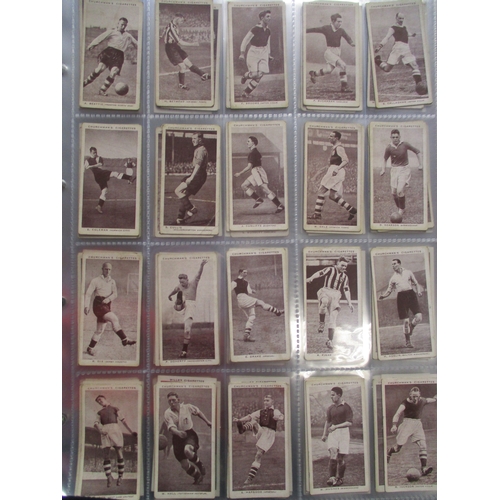 19 - Collection in stock books and albums with complete sets including Carreras Turf Footballers (49), Ch... 