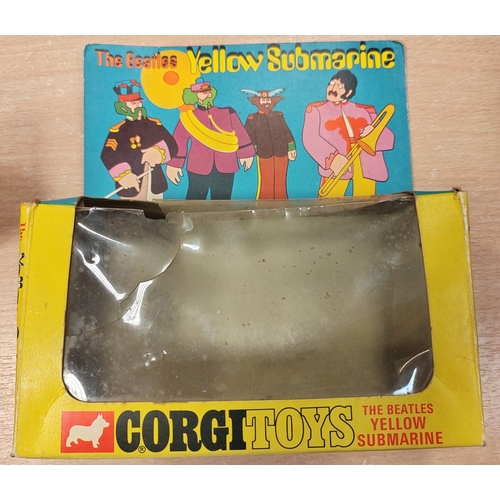 230 - Corgi. The Beatles Yellow Submarine No.803 finished in yellow, white, with red hatches, good conditi... 