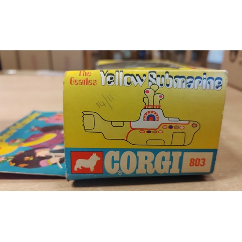 230 - Corgi. The Beatles Yellow Submarine No.803 finished in yellow, white, with red hatches, good conditi... 