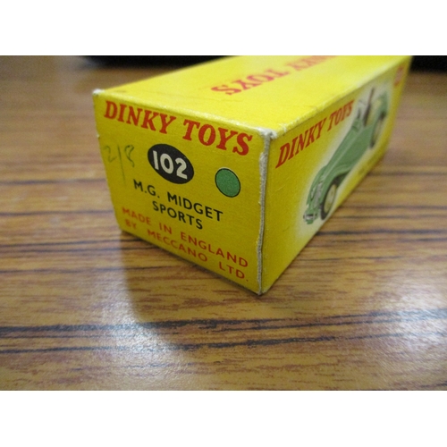 239 - Dinky. M.G. Midget Sports, lime green No 102, generally excellent in excellent box. (See photo) (T)