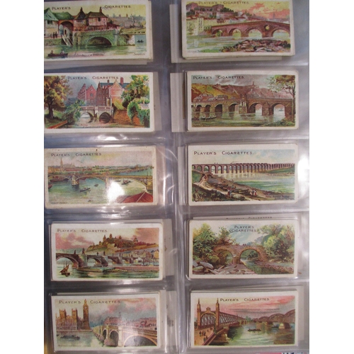 25 - Collection in albums and stock books with complete sets including Players Celebrated Bridges, Celebr... 