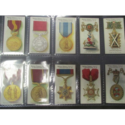 59 - Taddy. Complete set in plastic sleeves with 1912 British Medals & Decorations generally very good. C... 