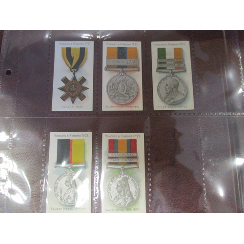 64 - Taddy. Complete set in plastic sleeves with 1915 Honours & Ribbons generally very good. Cat. £700. (... 