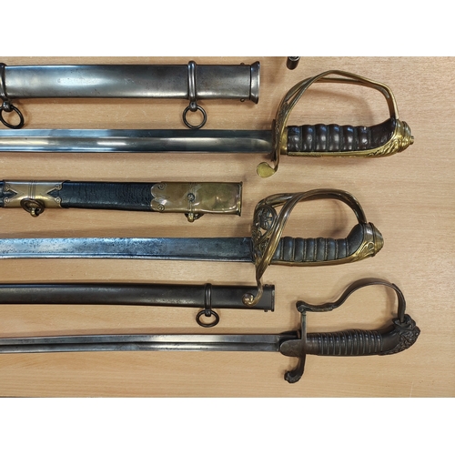 154 - Range of replica swords and mix of metal and leather scabbards with British 1805 pattern Royal Navy ... 