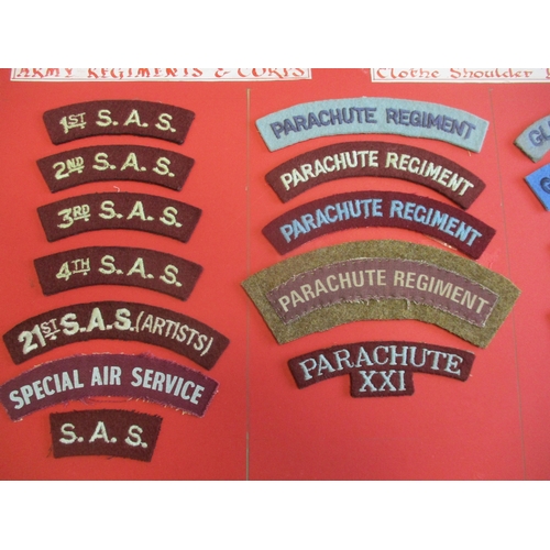 184 - Cloth shoulder title collection mounted on 2 boards with double sided tape. Mainly embroidered lette... 