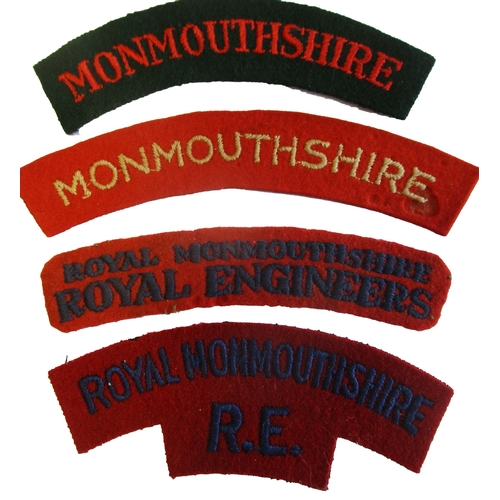 187 - Monmouthshire cloth shoulder title range with:
1. Monmouthshire, red embroidered lettering on dark g... 