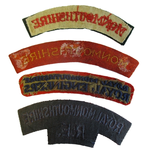 187 - Monmouthshire cloth shoulder title range with:
1. Monmouthshire, red embroidered lettering on dark g... 