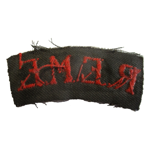 189 - WW2 R.E.M.E. cloth shoulder title, red embroidered lettering on black background, frayed edges, prob... 